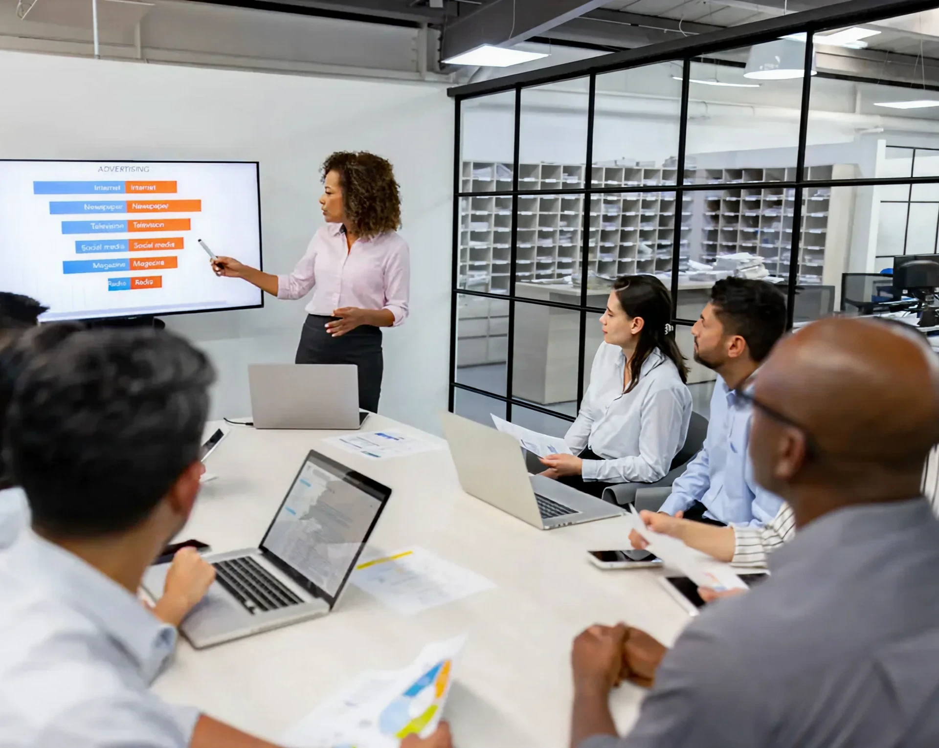 Business meeting with a presentation screen.